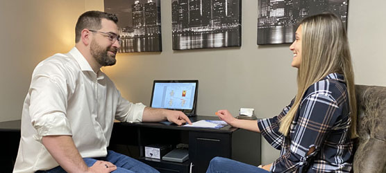 Chiropractor Berkley MI Nick Novakoski Reviewing Paperwork Chiropractor Berkley MI Nick Novakoski Reviewing Paperwork